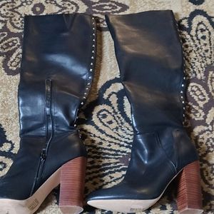 Full-length high heeled boots